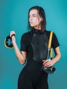 Dive deep. Sensual woman with scuba gear and dive equipment. Sexy diver with wet hair holding dive mask and camera for Royalty Free Stock Photo