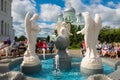 DIVEEVO, Pilgrims and tourists relax in cool near the fountain