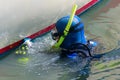 Diver cleaning boat hull sailboat maintenance work