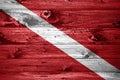 Diver Down flag on wooden planks background