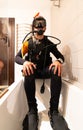 A diver dressed in scuba gear, in the bathtub. Home confinement Royalty Free Stock Photo