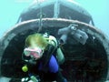 A Diver Emerges From the Nose of a Sunken DC-3 in the Marshall Islands