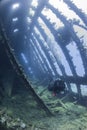 Diver exploring a large shipwreck