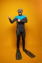 Diver man showing thumb up on yellow background, traveling concept Royalty Free Stock Photo