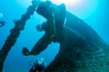 Diver near propeller ship wreck in the blue sea Royalty Free Stock Photo