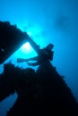 A diver passing through the stern section of Royalty Free Stock Photo