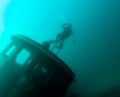 Diver Saluting While On A Tugboat Shipwreck In Lake Superior