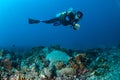 Diver is swimming above the coral reefs in Gili, Lombok, Nusa Tenggara Barat, Indonesia underwater photo