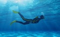 Diver swimming underwater.