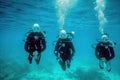 Diver underwater view with a group of scuba divers in clear blue water.