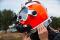 Diver in a diving suit and helmet ready to dive