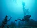 Diver Wreck Diving with Corals Growing on the Wreck in the Red Sea. Royalty Free Stock Photo