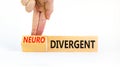 Divergent or neurodivergent symbol. Concept words Divergent Neurodivergent on wooden blocks. Beautiful white background.