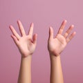 Diverging Paths: Close-Up of Pink Hands Pointing in Different Directions on Pastel Blue Background Royalty Free Stock Photo