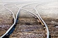 Diverging railroad tracks divide to run in different directions - Selective focus - Room for Copy