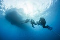 Divers decompressing underwater on a rope Royalty Free Stock Photo