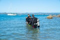 Divers entering water at Pilot Bay wharf for annual beach clean
