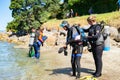 Divers entering water at Pilot Bay wharf for annual beach clean