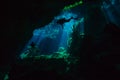 Divers exploring hidden reefs in underwater cave