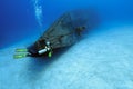 Divers exploring a shipwreck