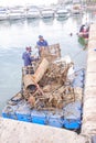 Divers removing dumped scrap and rubbish from alicante harbour