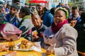 Diverse African people at a bread based street food outdoor festival