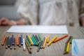 Diverse array of colored pencils is displayed on a wooden table