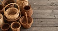 Assorted wicker baskets sit upon rustic gray wood Royalty Free Stock Photo
