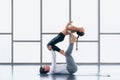 Athletic couple practicing acro yoga or yoga partner together in gym Royalty Free Stock Photo