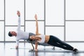 Athletic couple workout  with planking together in gym and fitness center Royalty Free Stock Photo