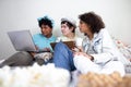 Diverse brazilian students working on school project in small bedroom with food snacks and drinks. Sense of teamwork and