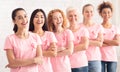 Diverse Breast Cancer Volunteers Group Standing Together Over White Background