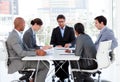 A diverse business group discussing a budget plan Royalty Free Stock Photo