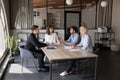 Diverse business group discussing job, talking at large table Royalty Free Stock Photo