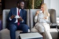 Diverse business man and woman have nice talk