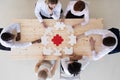 Diverse business people assembling puzzle Royalty Free Stock Photo