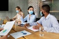 Diverse Business People In Protective Face Mask Attending Conference In Office