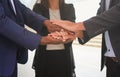 diverse business people stacked hands support together