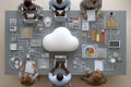 Diverse business team collaborating around a table with cloud technology graphics Royalty Free Stock Photo