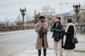 Diverse business team in discussion on city street bridge, urban collaboration. Royalty Free Stock Photo