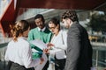 Diverse business team engaged in outdoor meeting in city on sunny day Royalty Free Stock Photo