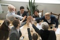 Diverse business team giving high five showing unity, top view Royalty Free Stock Photo
