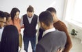 Multiracial team of happy young business people standing together and hugging each other Royalty Free Stock Photo