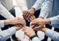 Diverse team joins hands in unity for collaborative business success Royalty Free Stock Photo