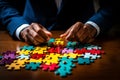 Diverse business team solving colorful puzzle on white background, concept of effective teamwork