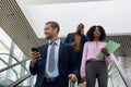 Diverse business travellers on an escalator Royalty Free Stock Photo