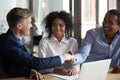 Diverse businessmen finish successful negotiations with handshake Royalty Free Stock Photo