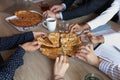 Diverse businesspeople colleagues eating pizza at workplace on lunch break Royalty Free Stock Photo