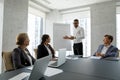 Diverse businesspeople gather in board room take part in meeting Royalty Free Stock Photo