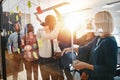 Diverse businesspeople high fiving together after an office brai Royalty Free Stock Photo